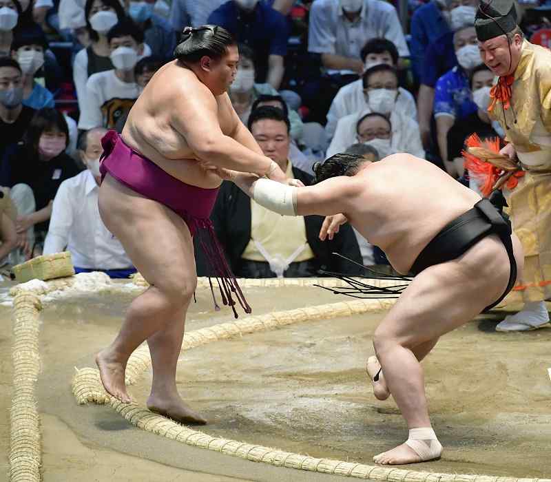 Rehabilitated sumo wrestler repays stablemaster with 1st