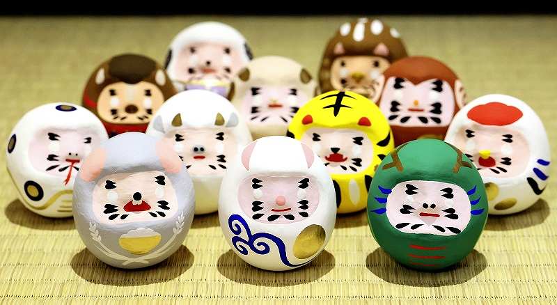 Set of japanese new year daruma dolls. Traditional daruma dolls in