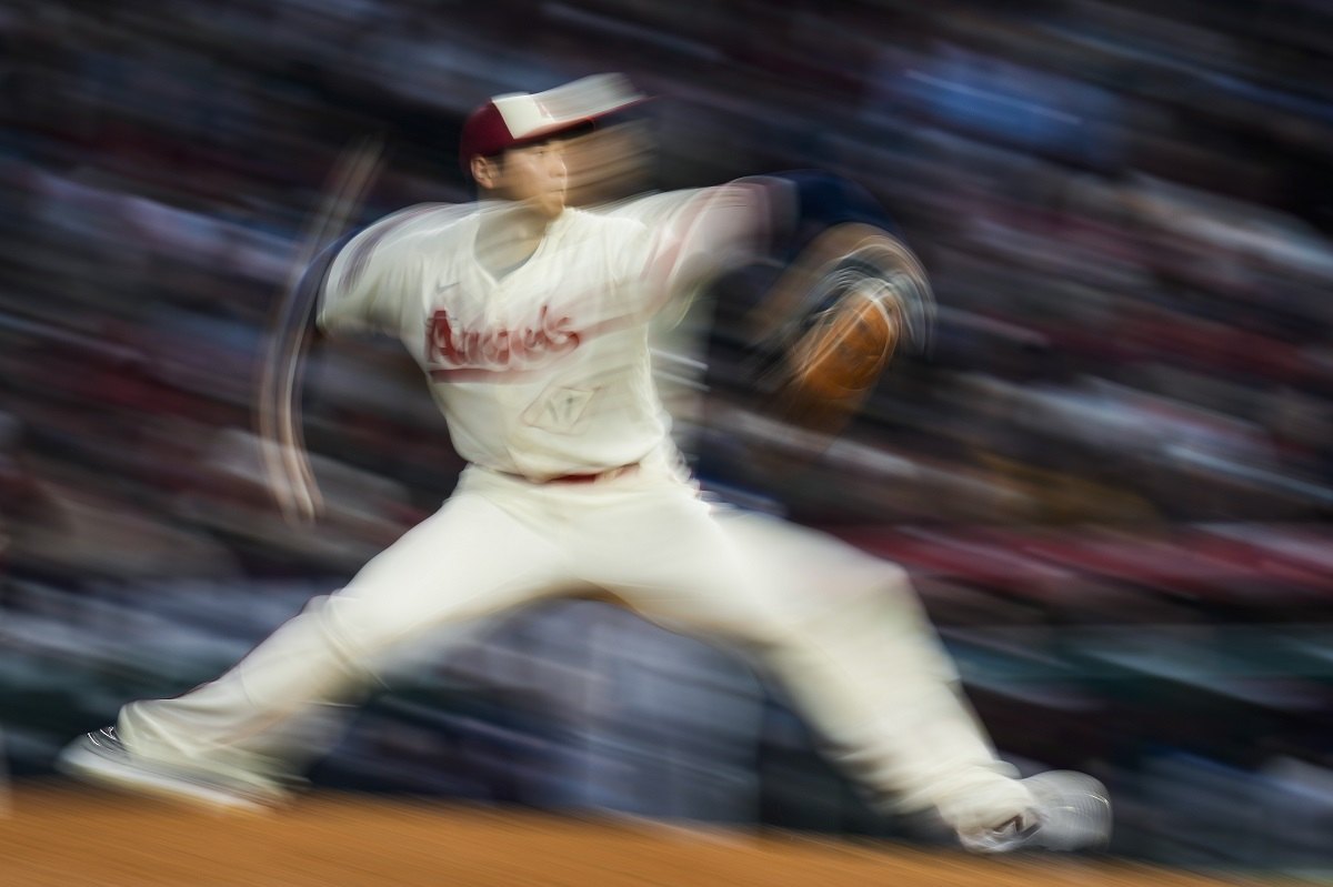 Japanese Shohei Ohtani throws a ball in the first inning during