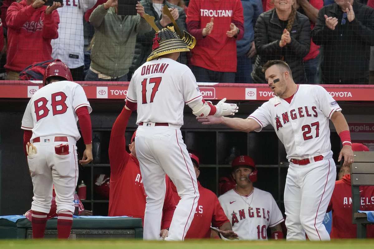 Masataka Yoshida of the Boston Red Sox celebrates in the dugout