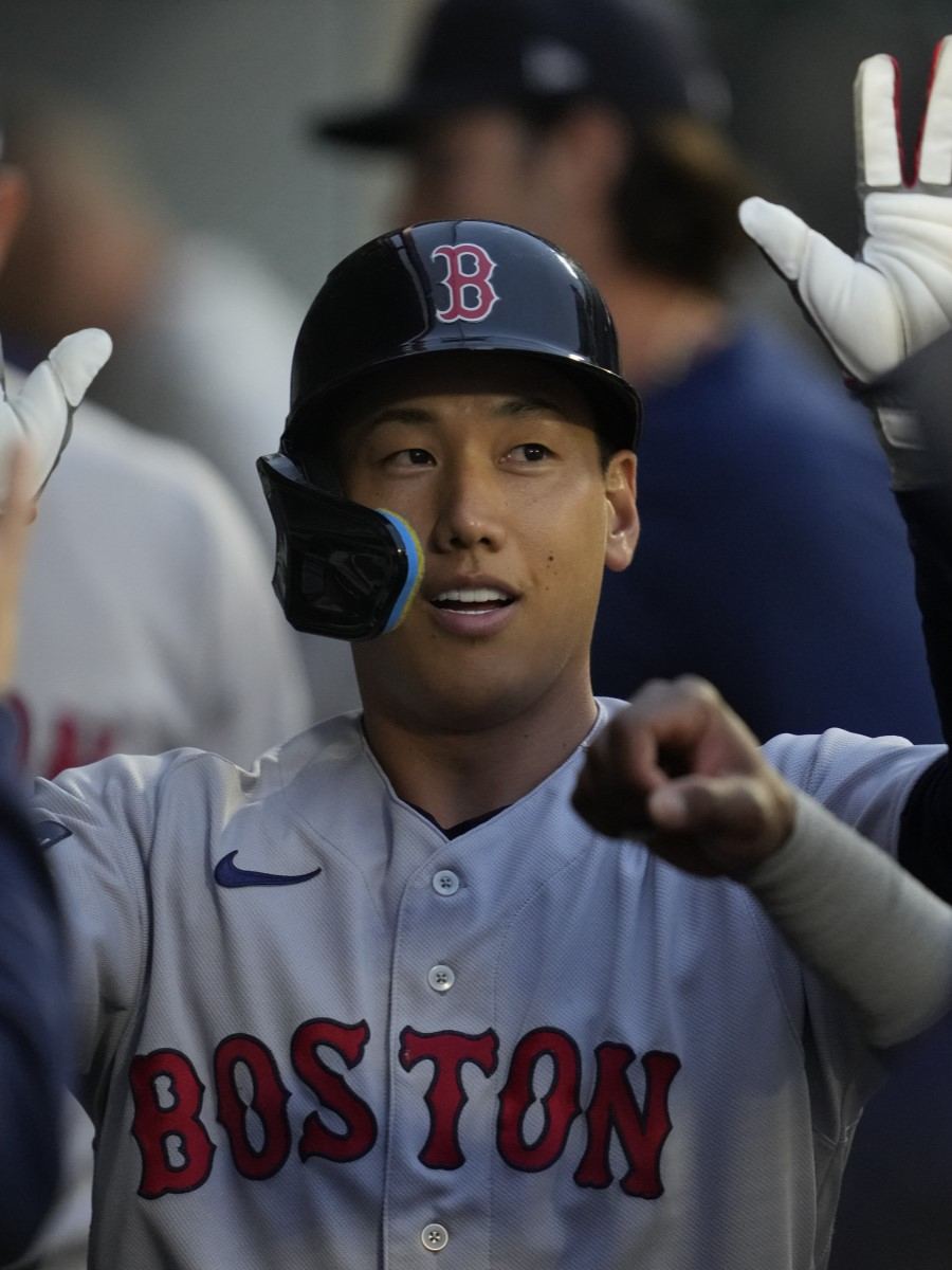 Masataka Yoshida of the Boston Red Sox walks back to the dugout