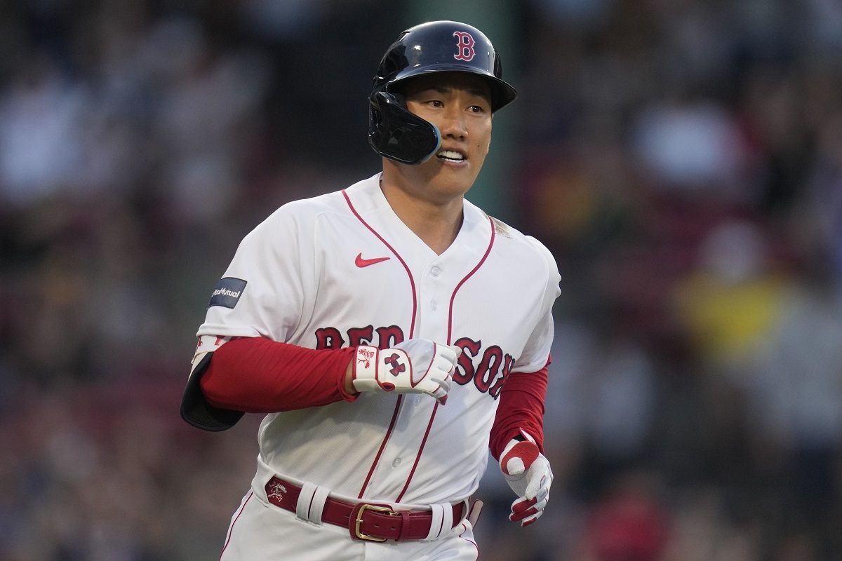 Masataka Yoshida of the Boston Red Sox runs to first after hitting