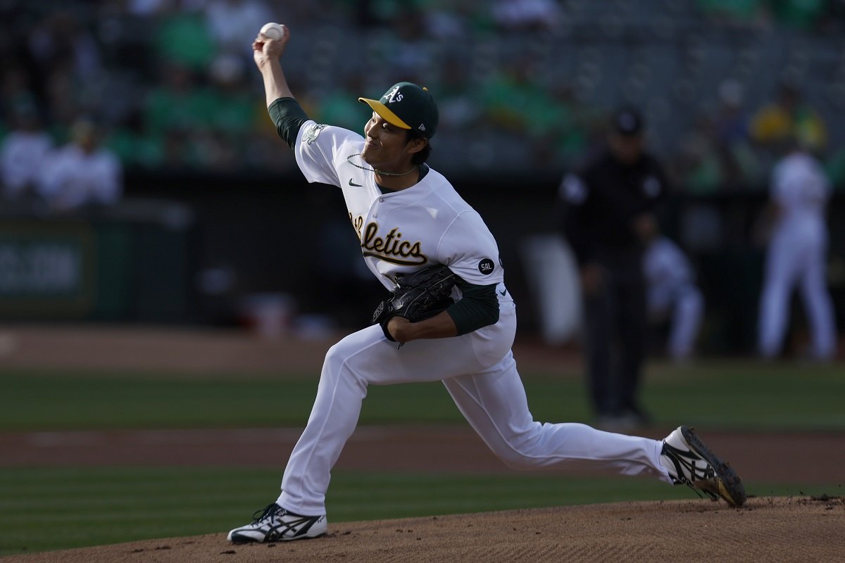 Shintaro Fujinami (L) of the Oakland Athletics and Masataka