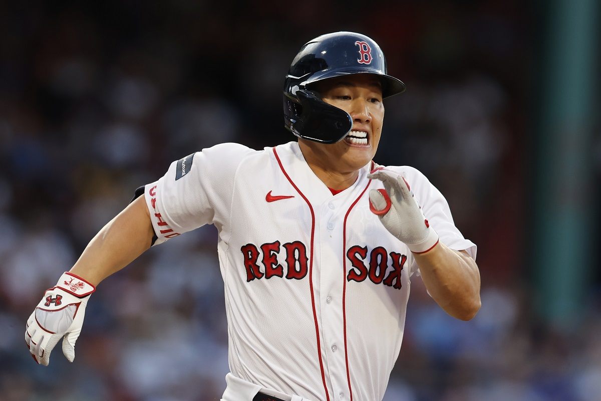 Masataka Yoshida of the Boston Red Sox runs to first after hitting