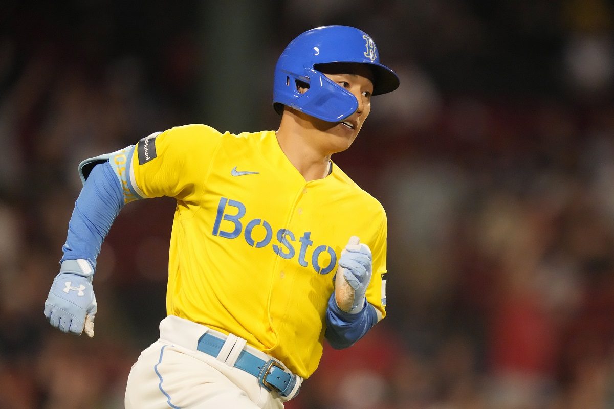 Masataka Yoshida of the Boston Red Sox runs to first after hitting